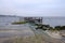 breakwater in sea with old metal railing port dock