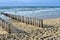 Breakwaters on the beach at the north sea in Domburg Holland