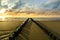 Breakwaters on the beach at sunset in Domburg Holland