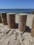 Breakwaters stump wooden. Shadows of people on the pier. Baltic Sea view from Svetlogorsk, Kaliningrad region