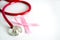 Breast Cancer Health  insurance  for Medical Healthcare disease insurance concept ,  a stethoscope and pink ribon on white