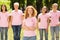 Breast Cancer Volunteer Standing With Group Of Women In Park