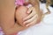 Breast feeding: woman breastfeeds her tiny newborn baby