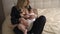 Breast feeding: Young blonde mother breastfeeds her baby boy child in bedroom wearing black sleeping robe costume - Son