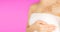 Breast Self-Exam BSE. Beautiful Young Asian Woman Wearing A Pink Strapless Checking Her Breast on Pink Background. Sexy Female