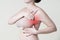 Breast test, woman examining her breasts for cancer, heart attack, pain in human body