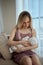 Breastfeeding consultant supports young mother to overcome problems.