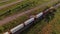 Breathtaking aerial of a freight train passing through countryside