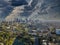 A breathtaking aerial shot of downtown Los Angeles with skyscrapers lush green trees, small buildings and homes