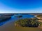 A breathtaking aerial shot of the still blue waters of Lake McIntosh at sunset