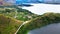 Breathtaking Aerial Views Capturing the Captivating Landscape of a Great Lake with Hills and Roadways Adding to the Visual Delight