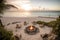 breathtaking beachfront property with private access to the sand, featuring an outdoor shower, lounge chairs, and a fire pit.