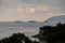 Breathtaking bird`s-eye landscape on the mountain and island in the sea in the foreground of trees