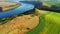 Breathtaking bird`s eye view of the Dniester River and agricultural land. Filmed in UHD 4k video