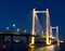 Breathtaking City Bridge at Night over Tranquil Water