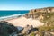 Breathtaking cliffs surround the sandy beach of Praia da Angra da Cerva on the Atlantic coast near Vila Nova de Milfontes, Odemira