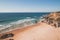 Breathtaking cliffs surround the sandy beach of Praia da Angra da Cerva on the Atlantic coast near Vila Nova de Milfontes, Odemira