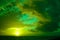 Breathtaking cloudy sunset sky scenery with vibrant green colors - perfect for a wallpaper