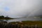 Breathtaking landscape in Scotland with a rainbow in the background