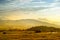 Breathtaking lansdcape of Austrian countryside on sunset. Dramatic sky over idyllic green fields of Anstrian Central Alps on autum