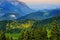 Breathtaking lansdcape of mountains, forests and small Bavarian villages in the distance. Scenic view of Bavarian Alps with majest