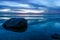 Breathtaking long exposure seascape on the coast of the Baltic Sea with a dark blue sky at dusk