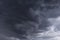 Breathtaking low angle shot of dark  gray cloud formation in the sky