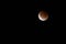 Breathtaking lunar eclipse against a dark background - perfect for wallpapers