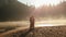 Breathtaking moment. Happy young countryside couple in ukrainian ethnic clothes tenderly embracing lit by sunrays on