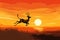 A breathtaking painting showcasing a deer gracefully leaping over a vibrant sunset horizon, A gazelle leaping across the