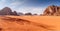 The Breathtaking Panorama of a Red Sand Desert Embracing Mountainous Rocks. Generative AI