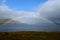 Breathtaking photo of a full rainbow in Scotland
