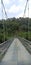 A breathtaking photograph of a majestic suspension bridge spanning over a river,