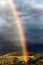 Breathtaking rainbow emerging in beautiful landscape - french pyrenees
