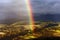 Breathtaking rainbow emerging in beautiful landscape - french pyrenees