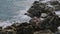 A breathtaking scene of Caribbean Sea, capturing slow-motion impact of waves against artificial breakwater on island