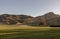 The breathtaking scenic landscape of Holyrood park with Salisbury Crags rugged hills and sky background