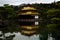 Breathtaking shot of a beautiful Kinkakuji temple with a reflection on a lake, Kyoto, Japan