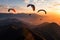 A breathtaking sight as a group of colorful parachutes gracefully soar through the air above a majestic mountain range,