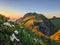 Breathtaking sunset in the mountains. View of the Bockmattli Innerthal and Lake Zurich. Hiking in Switzerland. Glarus