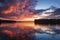 A breathtaking sunset over a calm lake, with fiery clouds reflected on the water's surface creating a symphony of