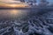 Breathtaking sunset scenery over the foamy ocean