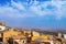 Breathtaking view of city Agrigento, island Sicily, Italy. Beautiful roofs of houses, agricultural field