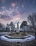 Breathtaking view of the fountain of Fallen Angel in Retiro park captured at sunset