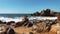 Breathtaking view of marina beach with massive stones rocks in daylight. Sea waves crashing on rocky coastline with