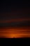 Breathtaking view of the sky with orange and yellow layers during nighttime