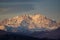 Breathtaking view of the snow-covered mountains under the dull sky