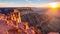 A breathtaking view of the sun slowly descending behind the magnificent Grand Canyon, A breathtaking view of the Grand Canyon at