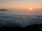 Breathtaking view of sunrise above clouds from the mountaintop