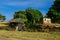 Breathtaking View to the Traditional African Houses, Green Trees and Mountains